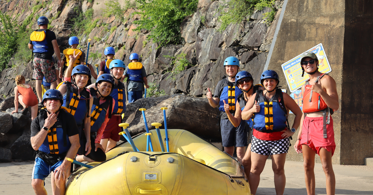 group of people getting ready to go rafting